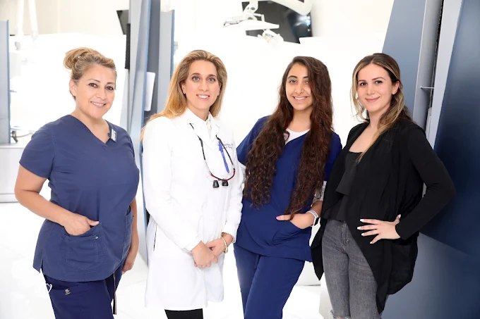 Dr. Malakuti with her dental team